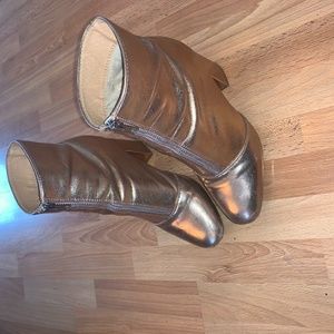 Metallic rose gold ankle booties with front zipper